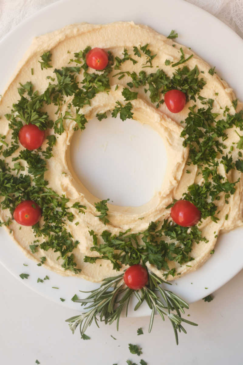 Make this festive holiday hummus wreath, when you want a quick and easy vegan appetizer that will make people smile. 