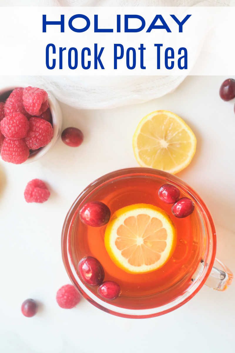 Holiday Crock Pot tea tastes amazing, when you simmer black tea, cranberries, raspberries and citrus fruit in your slow cooker. 