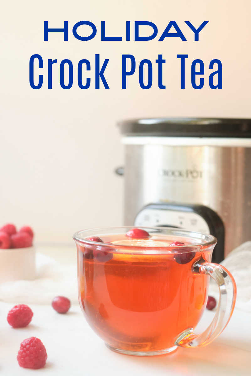 Holiday Crock Pot tea tastes amazing, when you simmer black tea, cranberries, raspberries and citrus fruit in your slow cooker. 