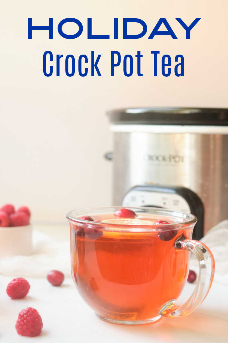 Holiday Crock Pot tea tastes amazing, when you simmer black tea, cranberries, raspberries and citrus fruit in your slow cooker. 