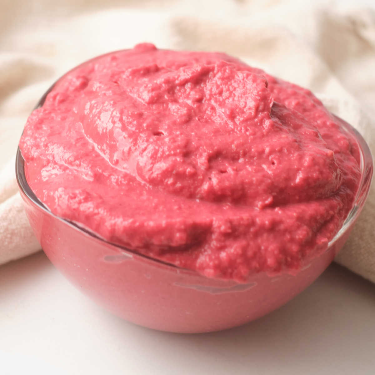 bowl of beet hummus with cumin