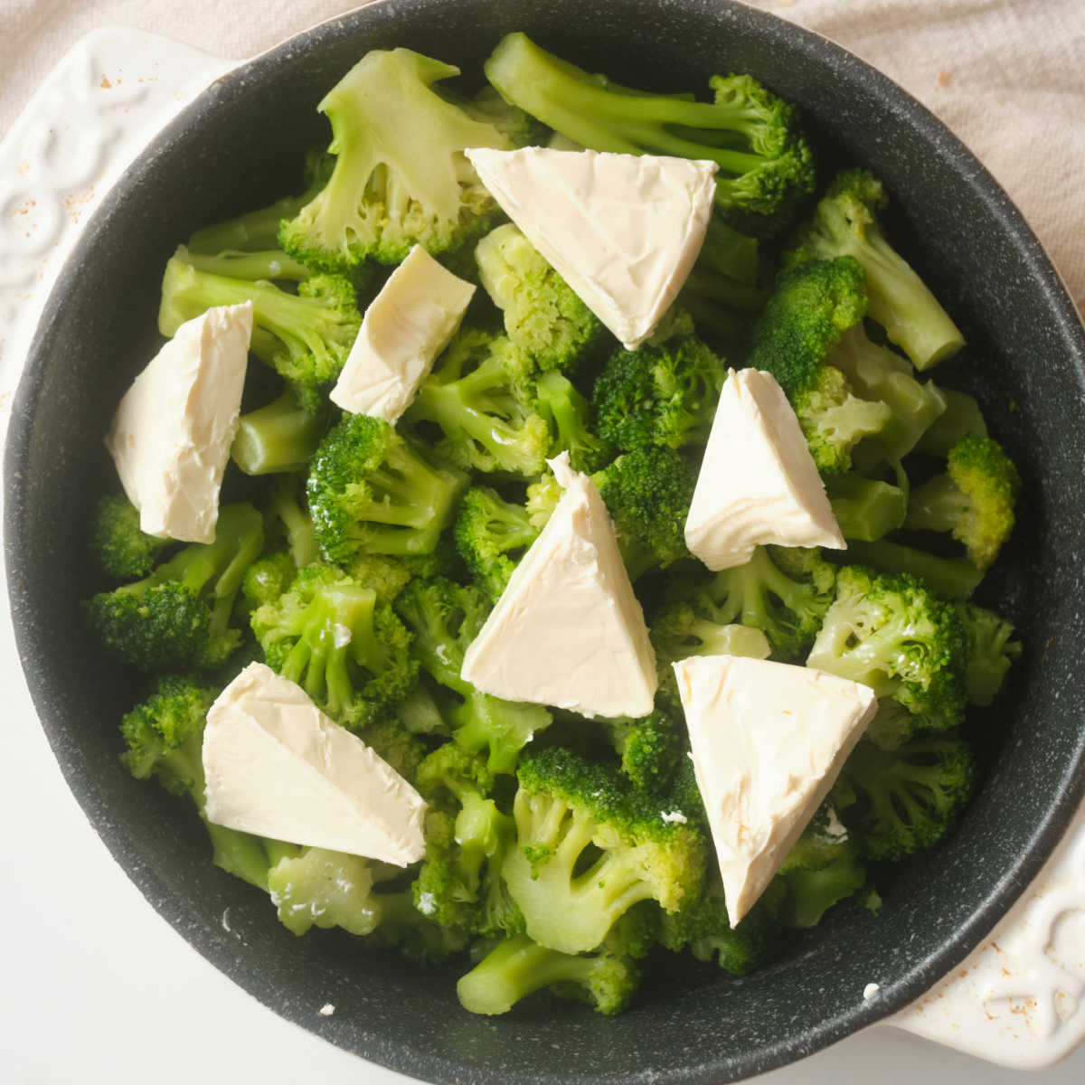 laughing cow cheese triangles on broccoli