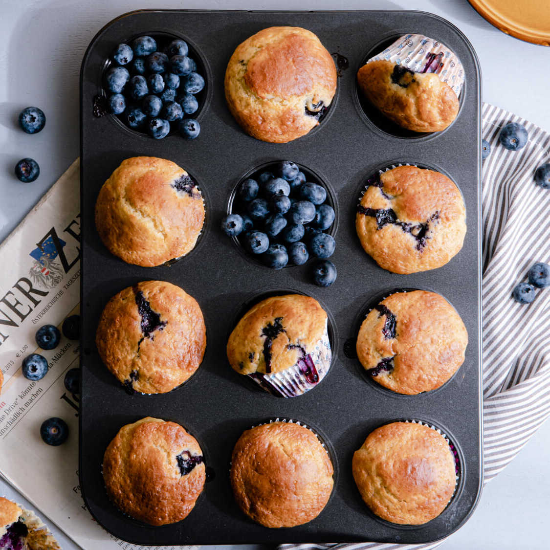 fresh lemon blueberry muffins in pan