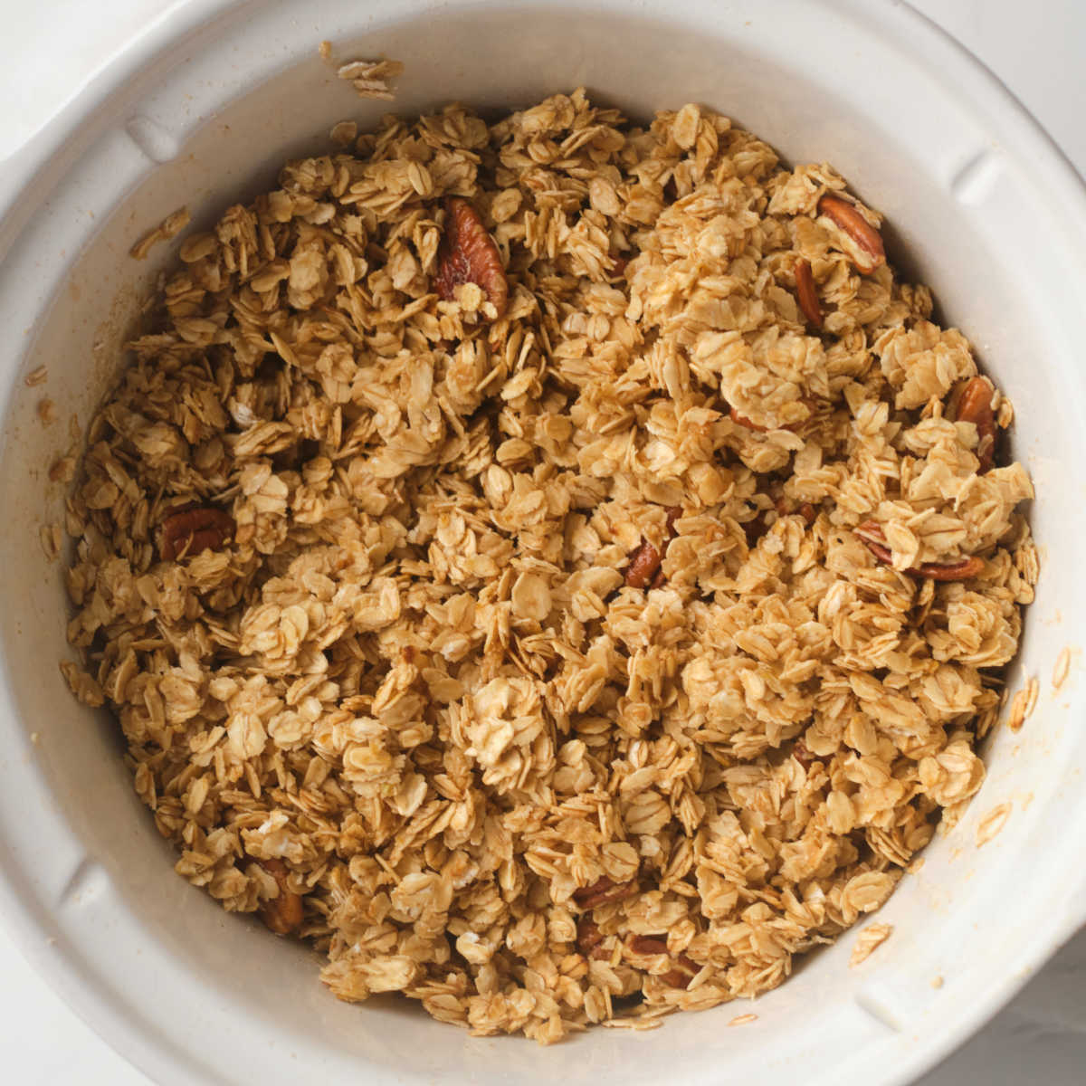 making maple pecan granola in slow cooker