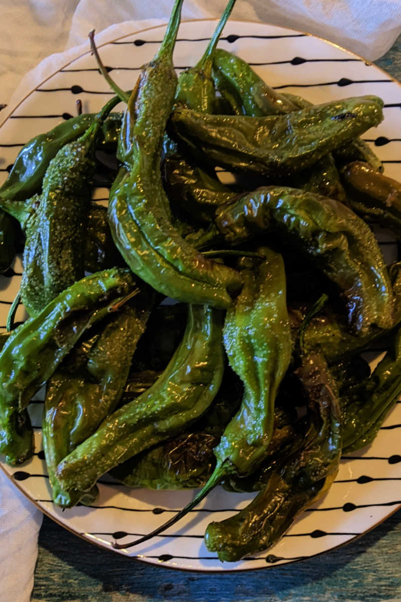 You can order blistered peppers at restaurants, but it is also very easy to roast shishito peppers in the oven at home. 