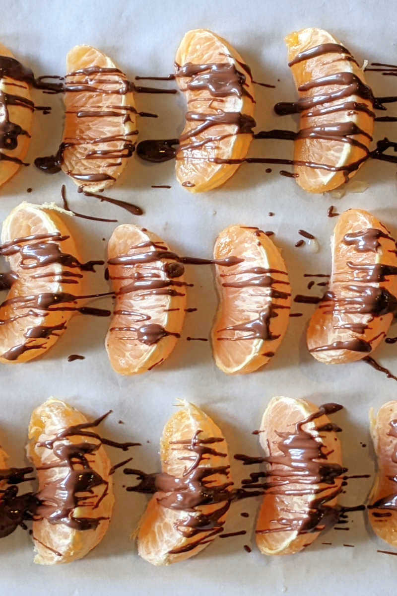 Indulge in a symphony of sweet and tangy with Chocolate Drizzled Pixie Tangerines! This incredibly easy recipe combines juicy mandarin oranges with a decadent chocolate drizzle for a delightful snack or dessert. Made with just 3 simple ingredients, it's the perfect way to satisfy your sweet tooth.