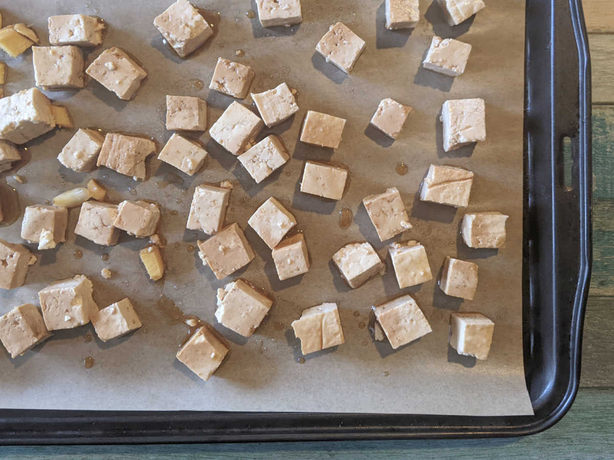 tofu on parchment covered baking sheet