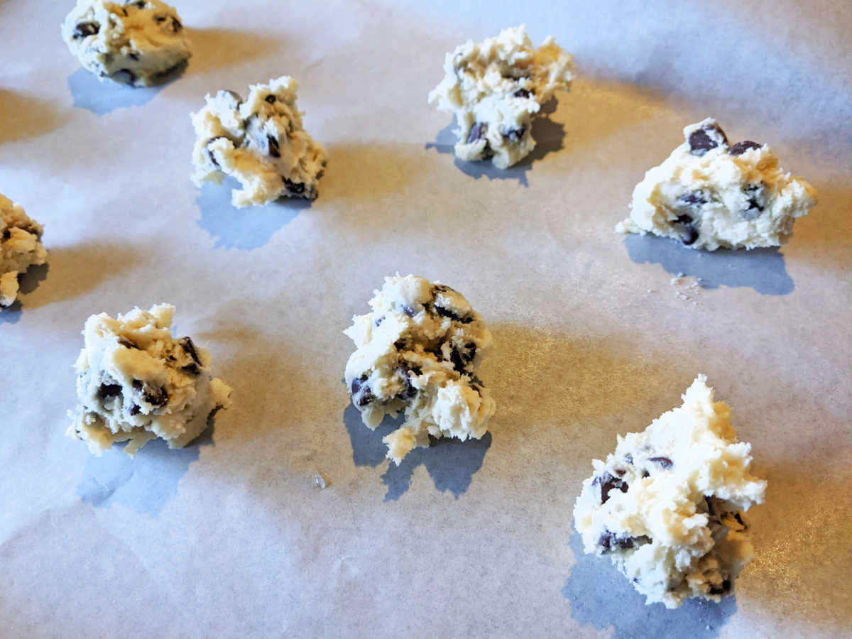 chocolate chip cookie dough on parchment