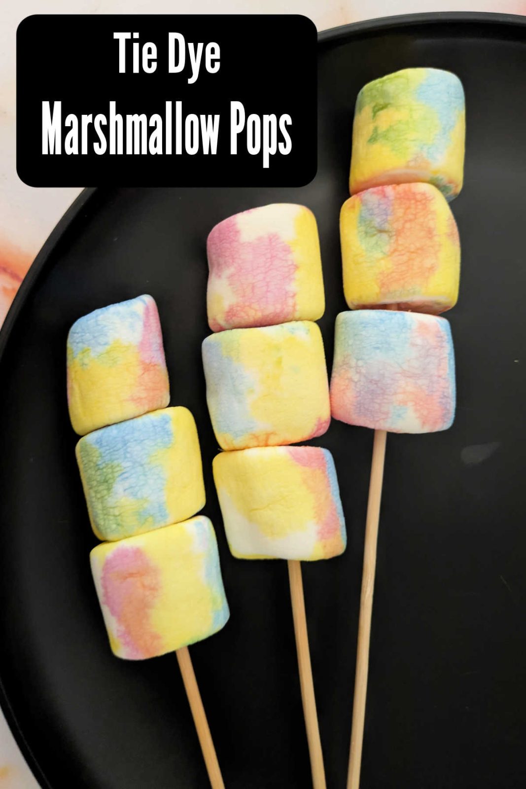 Make these fun and easy Tie Dye Marshmallow Pops for a colorful treat! A simple recipe using natural food coloring is perfect for kids and parties.