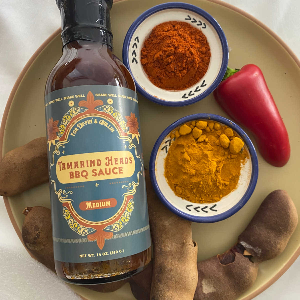 Tamarind Heads BBQ Sauce is delicious, unique, and made with simple clean ingredients. It is gluten free, vegan, and features a tart, tangy, smoky, sweet, and spicy profile that is "normal enough" for picky eaters!