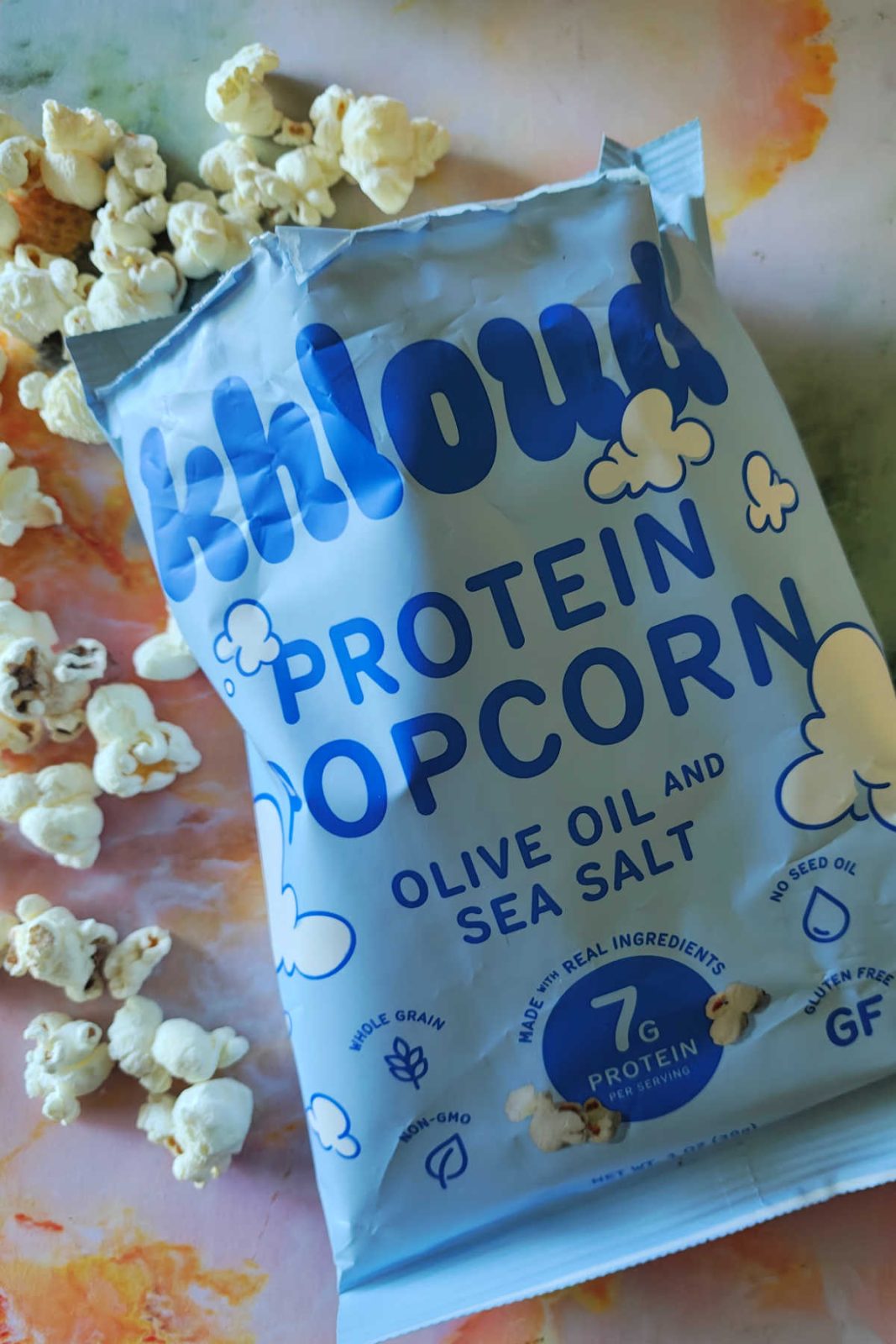 Khloud Protein Popcorn, by Khloe Kardashian, is a fluffy and delicious snack with 7g protein per serving. Available in White Cheddar, Olive Oil & Sea Salt, and Kettle Korn, it is GF, Whole Grain, and Non-GMO, making it an easy way to get extra protein! 🍿